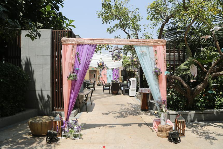 The entrance walk dressed in pastel drapes and lanterns
